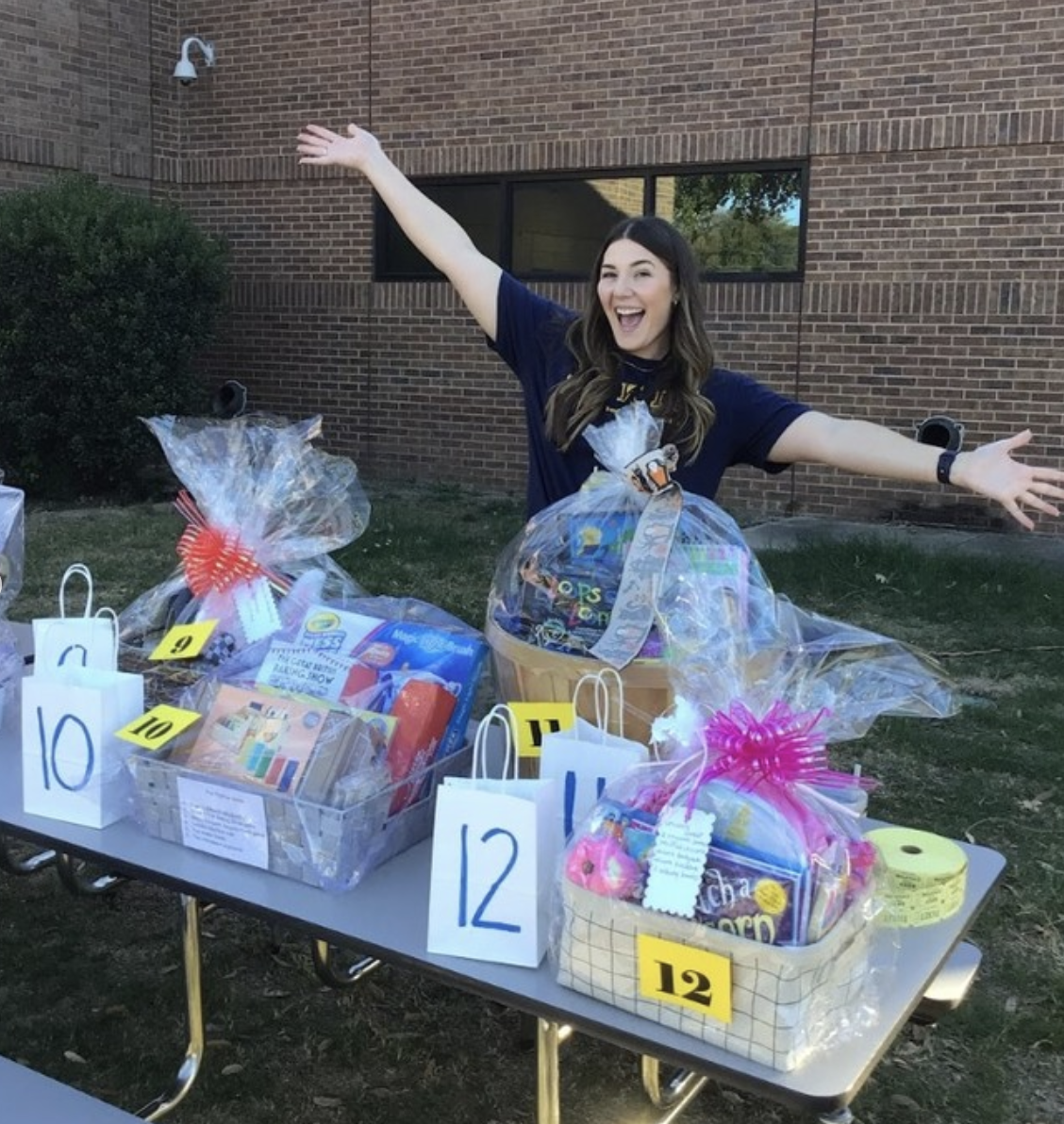 Teacher excited with basket raffle prizes