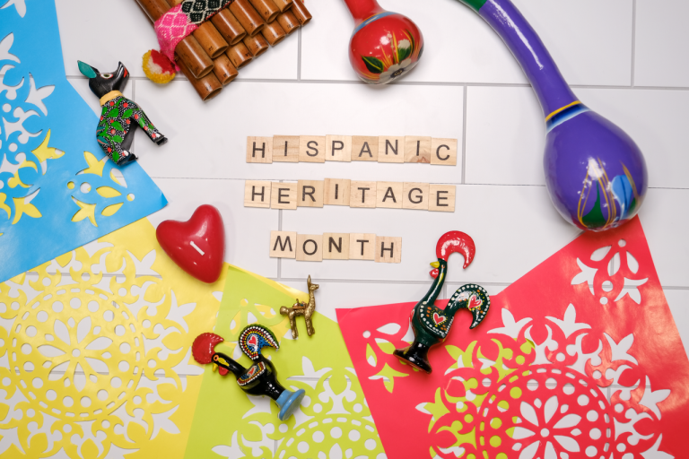 Colorful flat lay with Latin American crafts celebrating Hispanic Heritage Month.