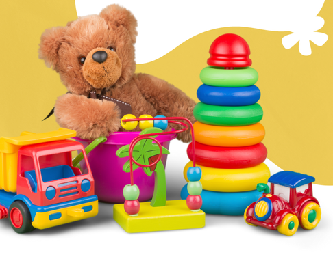 Picture of a collection of toys: a teddy bear, toy truck, rainbow stacking blocks, small toy train, and a bead puzzle maze