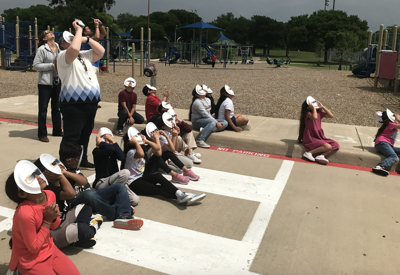 Students and staff viewing the solar eclipse.
