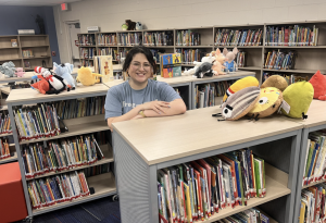 Mrs Palacios standing in the library.