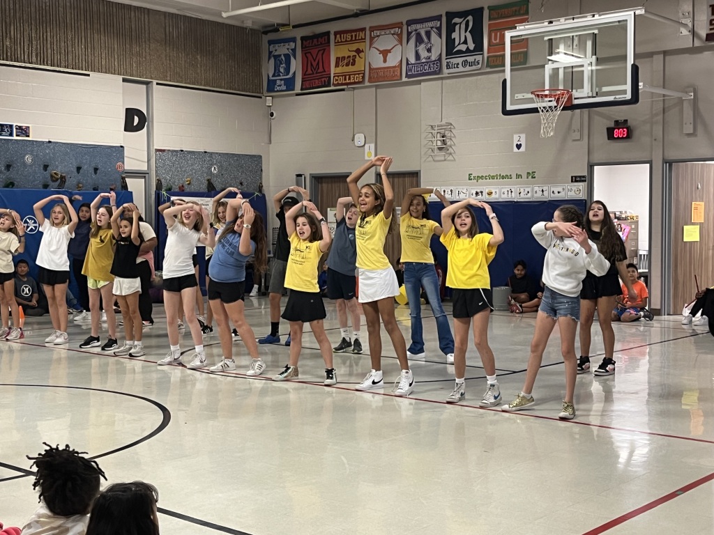 students dancing in a gym