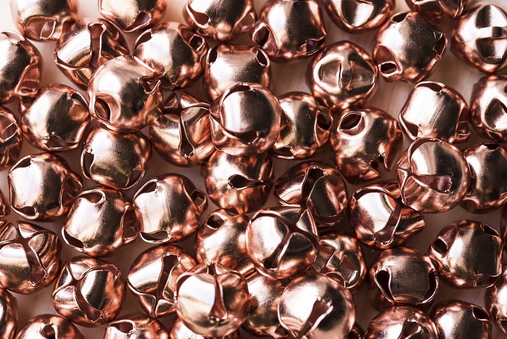 a bunch of bronze bells on a desk