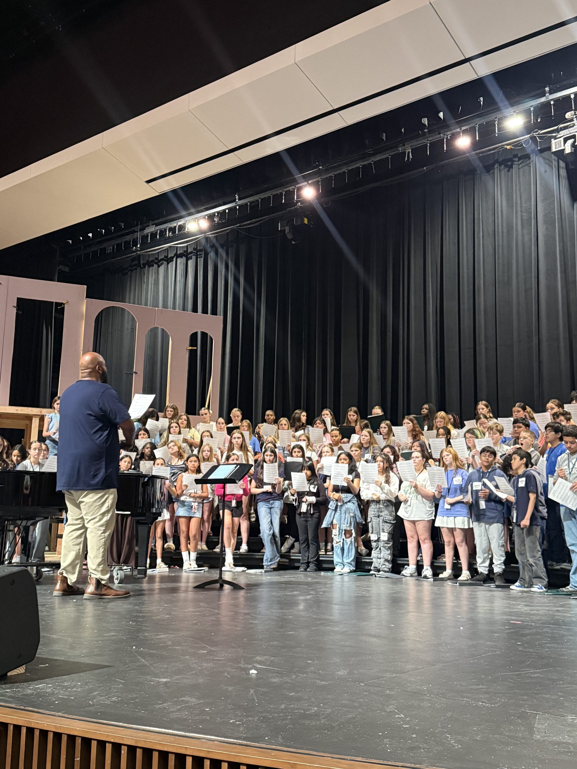 Colton Blake, The Choir Guy, leading the Pearce area choirs.