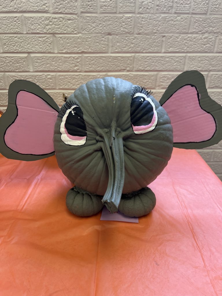 Students’ decorated pumpkins displayed on tables at Wallace Elementary’s annual pumpkin decorating contest, featuring creative and colorful designs.