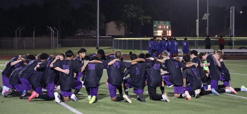 Charger Soccer players huddle