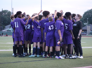 Charger Soccer Players huddle